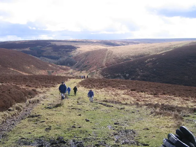 A footpath climbing Malmsmead Hill across open Exmoor moorland