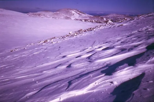 Snow-covered slopes of Ben Macdui with Cairngorm in the distance – the mountain where the Big Grey Man is said to roam.