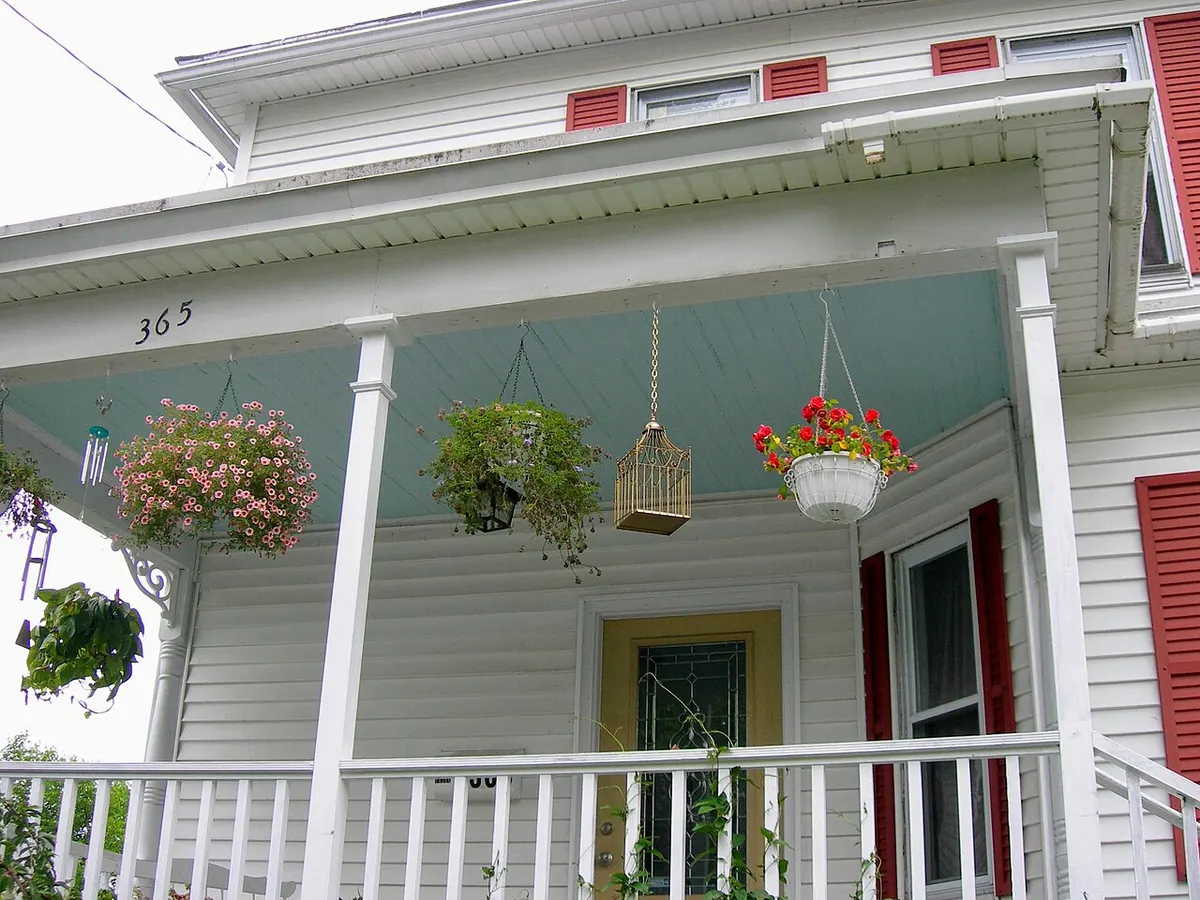 A porch ceiling painted haint blue, the traditional color said to keep haints and hags away.