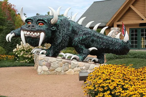 The large hodag statue in Rhinelander, Wisconsin, a horned, spiny, grinning green creature