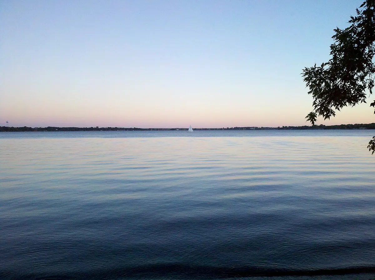 A sailboat on Lake Kampeska seen from Memorial Park in Watertown, South Dakota