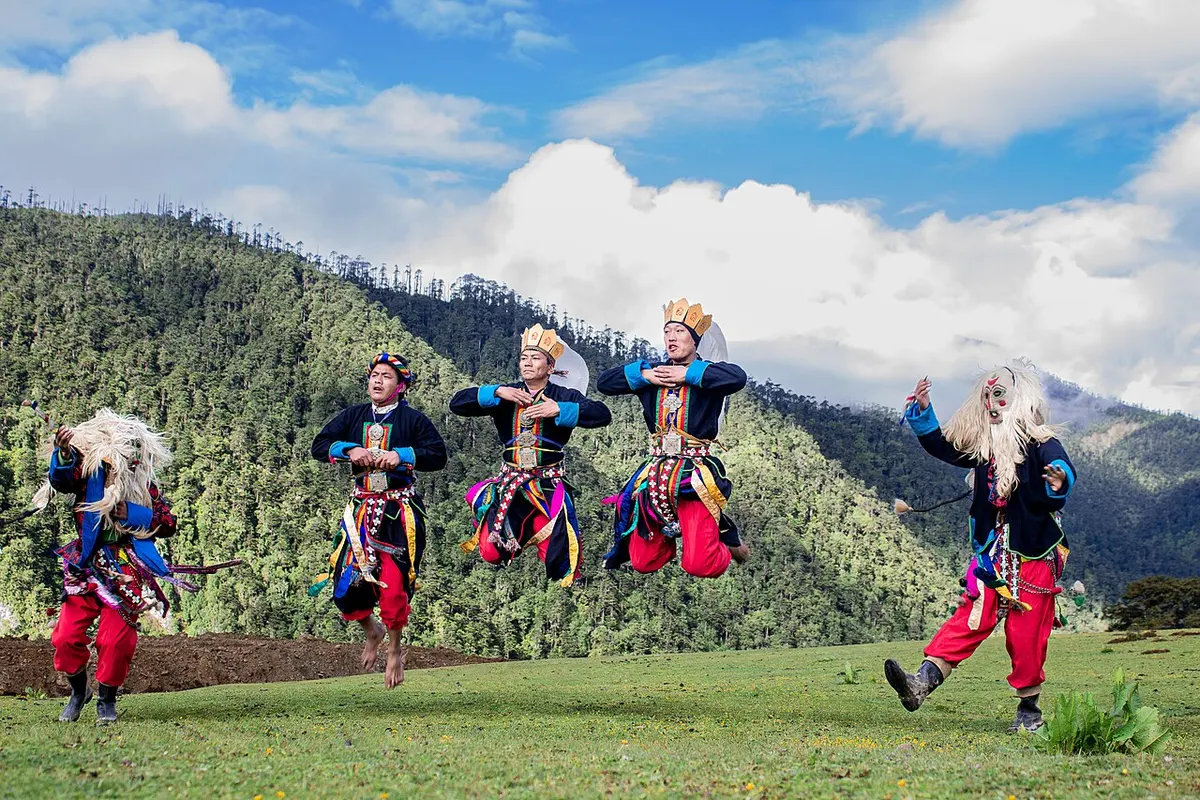 Brokpa performers in traditional dress dancing in eastern Bhutan
