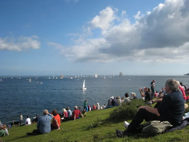 Rosemullion Head at the southern edge of Falmouth Bay, Cornwall, with ships waiting offshore