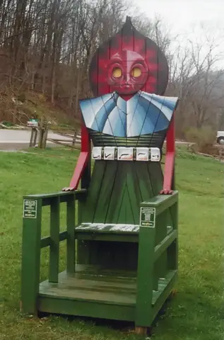 A giant chair shaped like the Flatwoods Monster on the lawn by the town hall in Flatwoods, West Virginia
