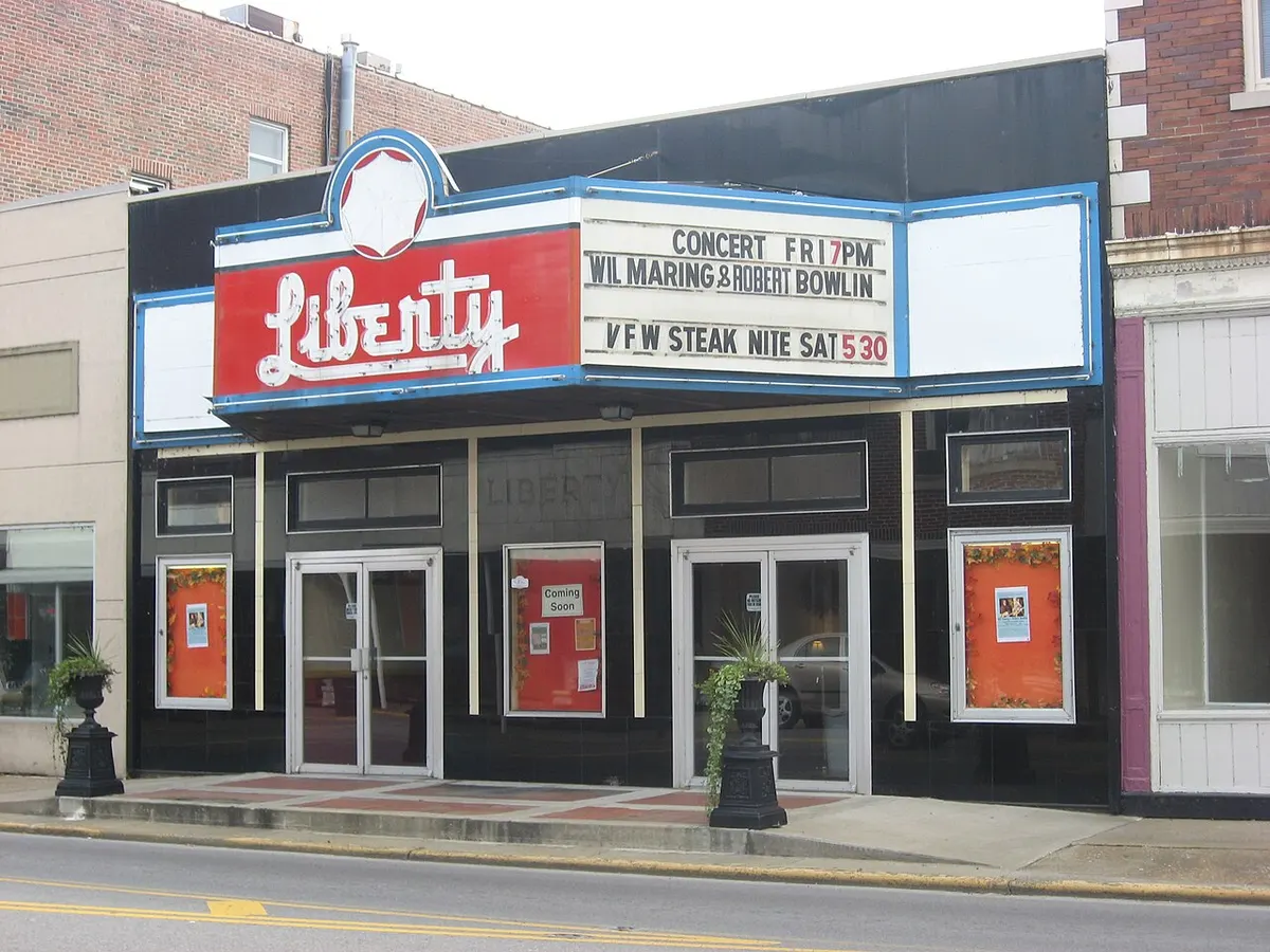 The dark-tiled front and red-and-white marquee of the Liberty Theater on Walnut Street in Murphysboro, Illinois