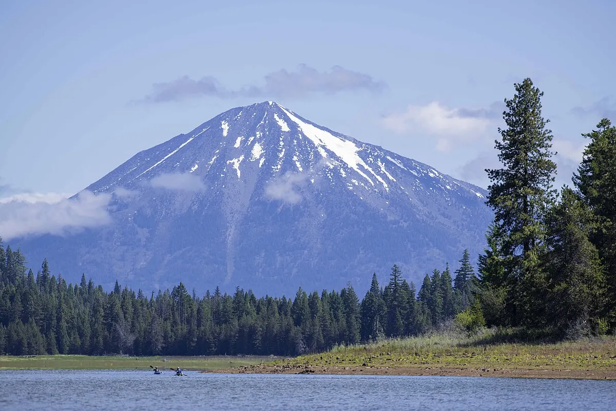 Calm water and conifer-lined shore at Hyatt Lake in the Cascade-Siskiyou National Monument, southern Oregon